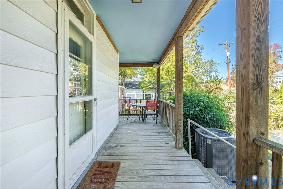 4404 Patterson Avenue, Richmond, VA 23221 Covered wood-plank porch featuring a light blue ceiling and natural wood support beams
