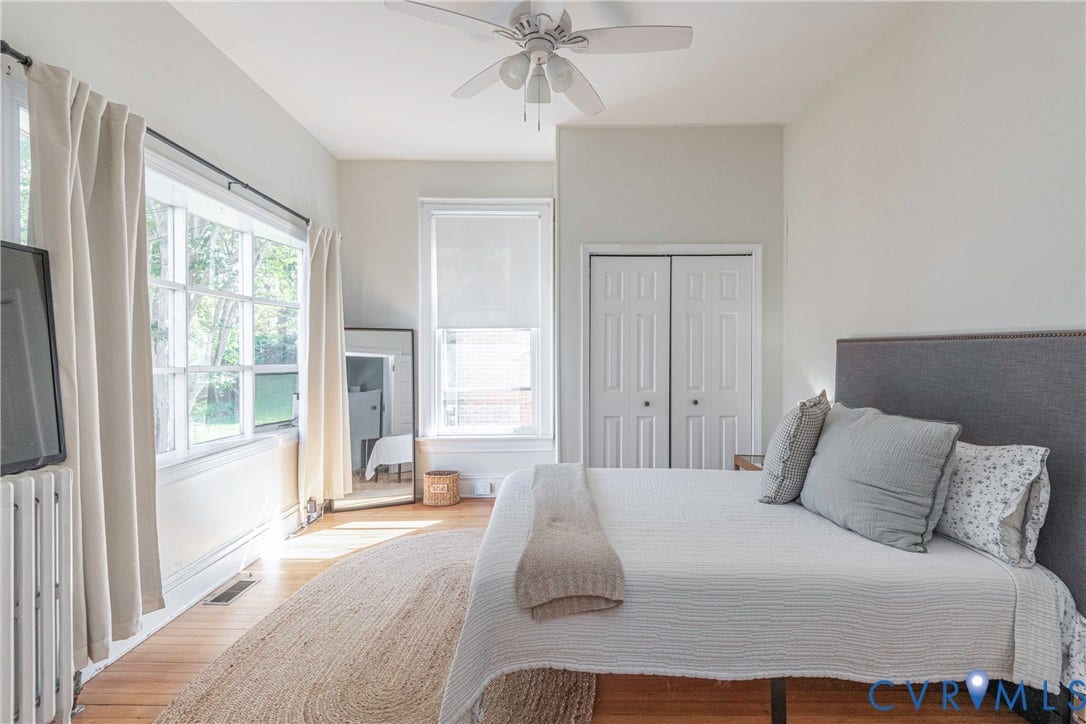 4404 Patterson Avenue, Richmond, VA 23221 Light-filled room featuring wood-finish flooring, a ceiling fan, and two windows