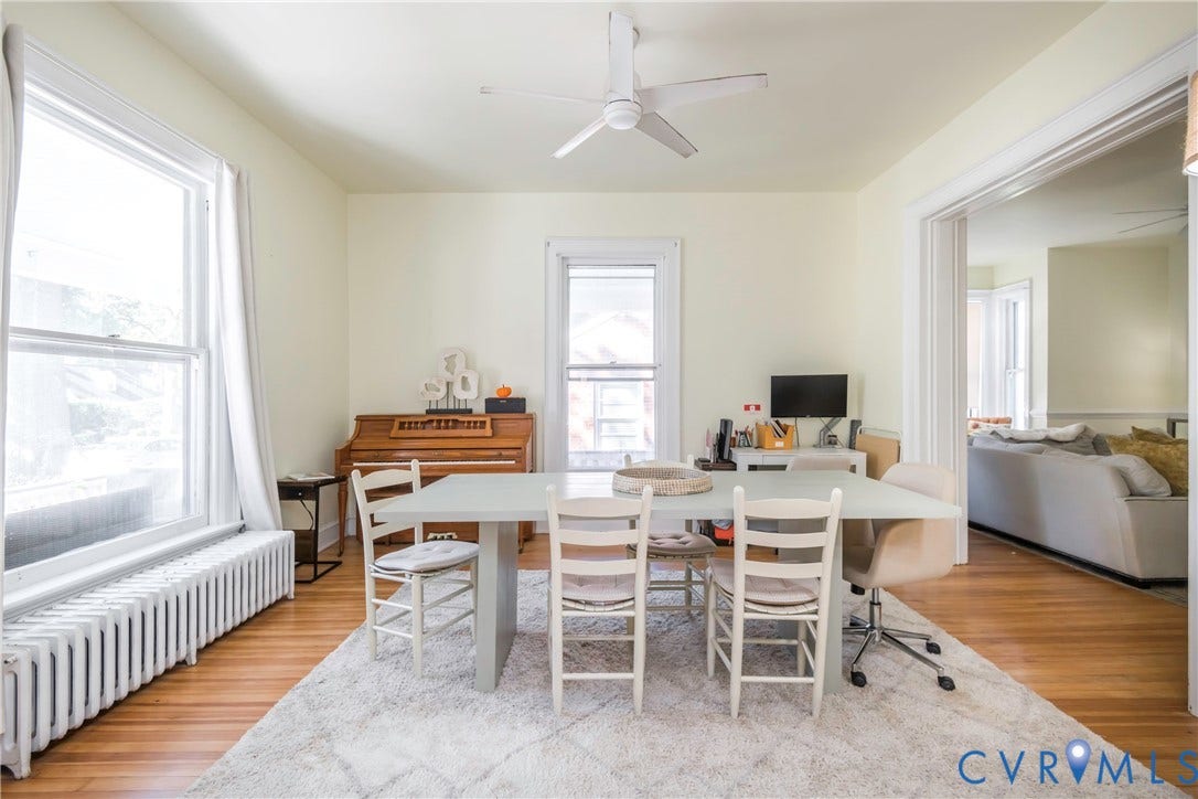 4404 Patterson Avenue, Richmond, VA 23221 Hardwood flooring throughout, recessed doorway, ceiling fan, and large windows with integrated radiator