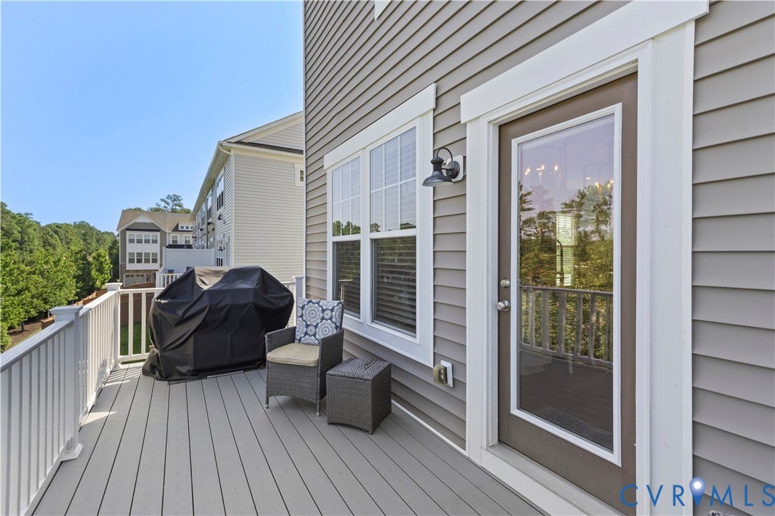 10414 Perennial Drive, Henrico, VA 23233 Expansive outdoor deck featuring composite decking, white railing, and a full-light panel door