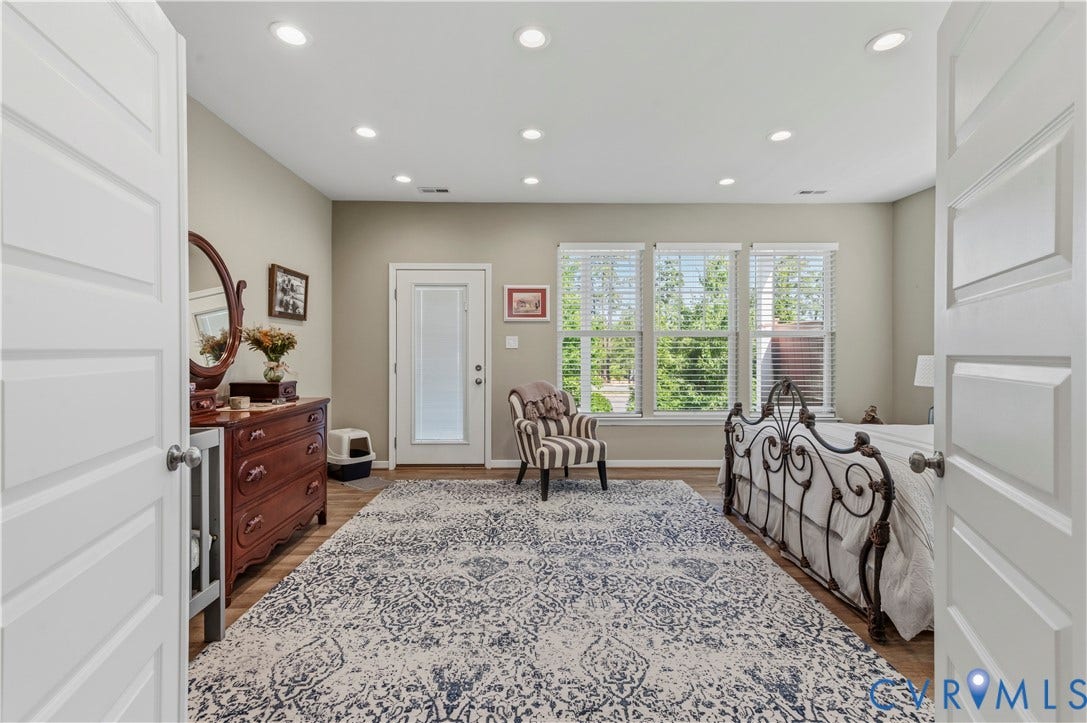 10414 Perennial Drive, Henrico, VA 23233 Spacious room featuring wood-finish flooring, recessed lighting, and a large area rug