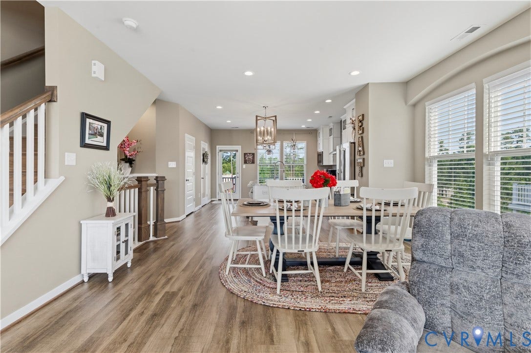 10414 Perennial Drive, Henrico, VA 23233 Open-concept living area featuring wood-finish flooring, recessed lighting, and a prominent staircase with white risers and wood handrails