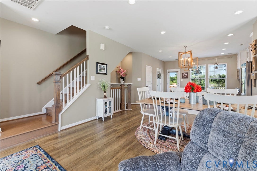 10414 Perennial Drive, Henrico, VA 23233 Open-concept living area with wood-finish flooring, a contemporary dining fixture, and recessed lighting