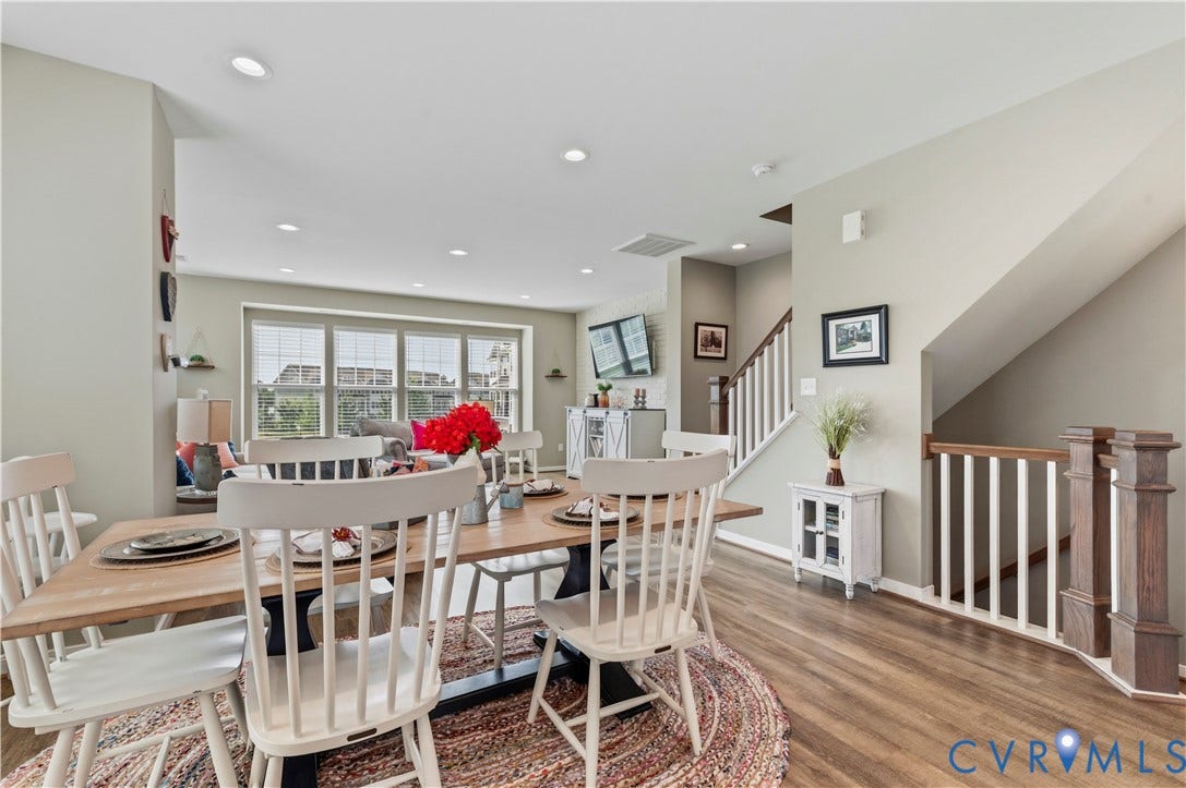 10414 Perennial Drive, Henrico, VA 23233 Open-concept dining area featuring wood-finish flooring, recessed lighting, and a staircase with white spindles and dark wood newel posts