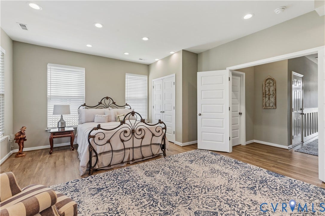 10414 Perennial Drive, Henrico, VA 23233 Recessed lighting illuminates this room featuring wood-finish flooring and neutral wall tones