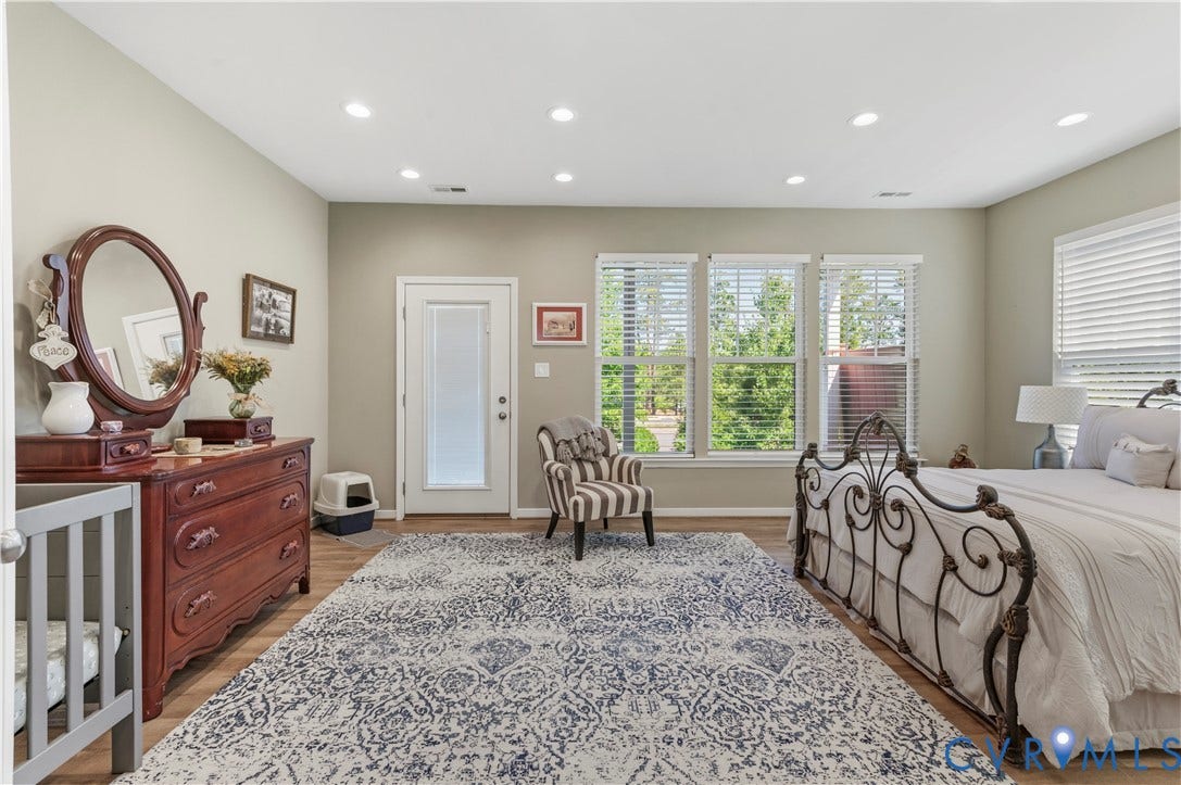 10414 Perennial Drive, Henrico, VA 23233 Spacious room featuring wood-finish flooring, recessed lighting, and ample natural light from multiple windows