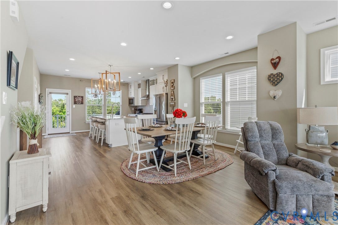 10414 Perennial Drive, Henrico, VA 23233 Open-concept interior featuring wood-finish flooring, recessed lighting, and a modern kitchen with a center island and white cabinetry