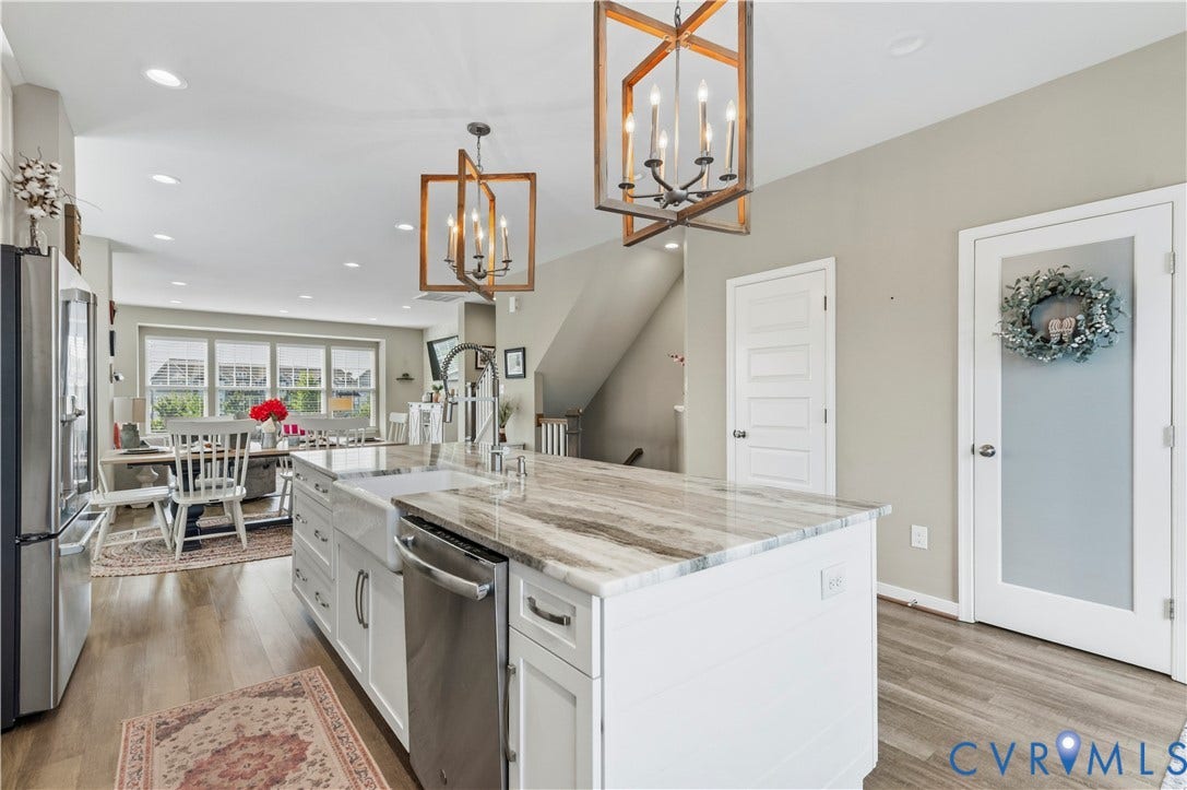 10414 Perennial Drive, Henrico, VA 23233 Kitchen island with a farmhouse sink, stainless steel dishwasher, and a stone countertop
