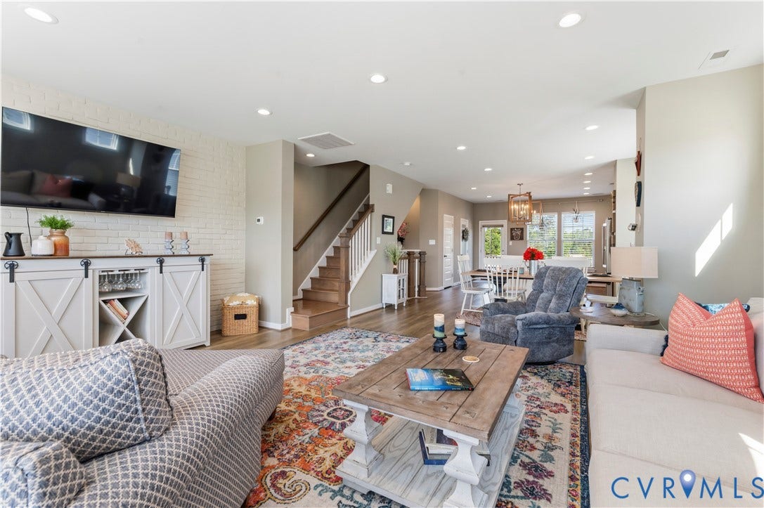 10414 Perennial Drive, Henrico, VA 23233 Open-concept living area featuring a white brick accent wall and recessed lighting