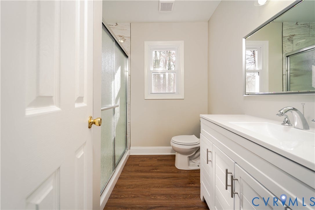 3025 Maplevale Road, Chester, VA 23831 Bathroom featuring a white vanity with integrated sink, chrome faucet, and rectangular mirror