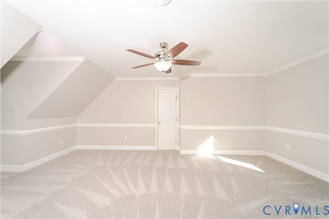 3025 Maplevale Road, Chester, VA 23831 Carpeted room featuring a ceiling fan with light fixture, chair rail molding, crown molding, and an interior door