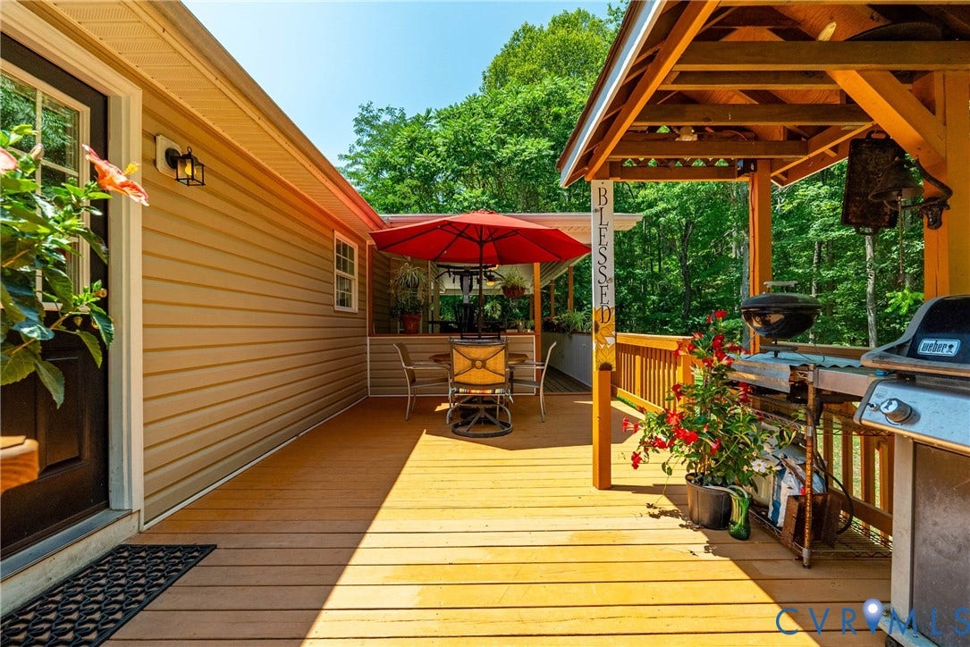 Expansive wood deck with a built-in pergola structure