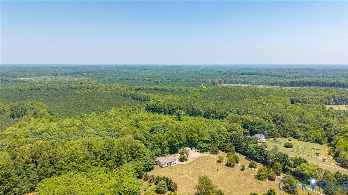 Expansive wooded acreage with two distinct residential structures