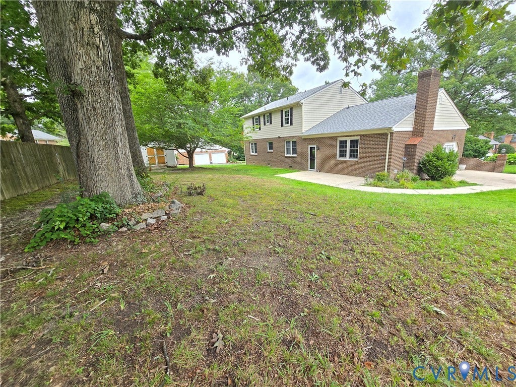3901 Buckland Place, Chester, VA 23831 Expansive rear yard featuring mature trees and a concrete patio
