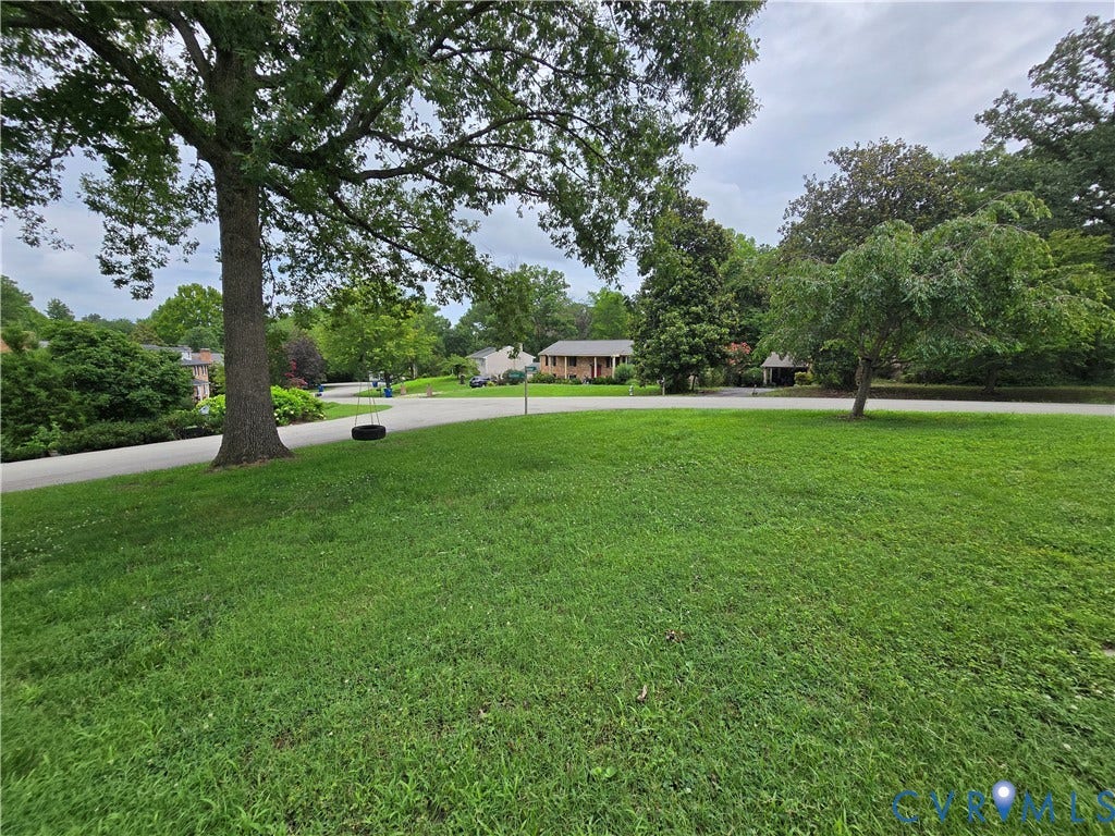 3901 Buckland Place, Chester, VA 23831 Expansive green lawn with mature trees and established landscaping