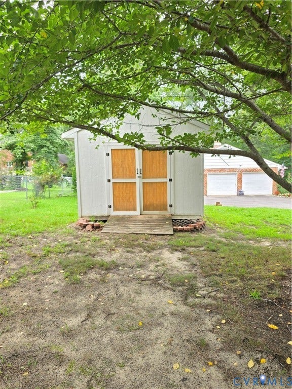 3901 Buckland Place, Chester, VA 23831 Detached storage shed with light-colored siding and double wood doors