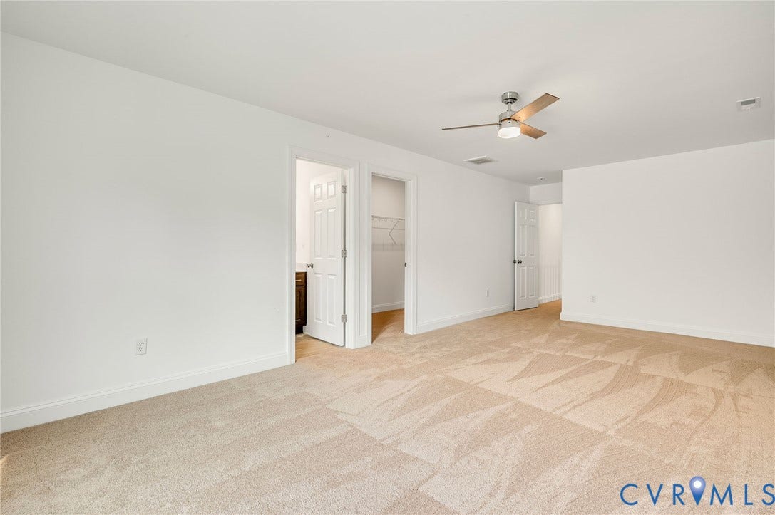 7130 Maple Summit Lane, Moseley, VA 23120 Spacious room featuring light-toned carpeting and neutral wall tones