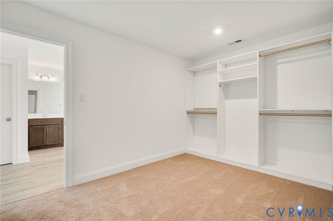 7130 Maple Summit Lane, Moseley, VA 23120 Bedroom featuring a built-in closet organization system