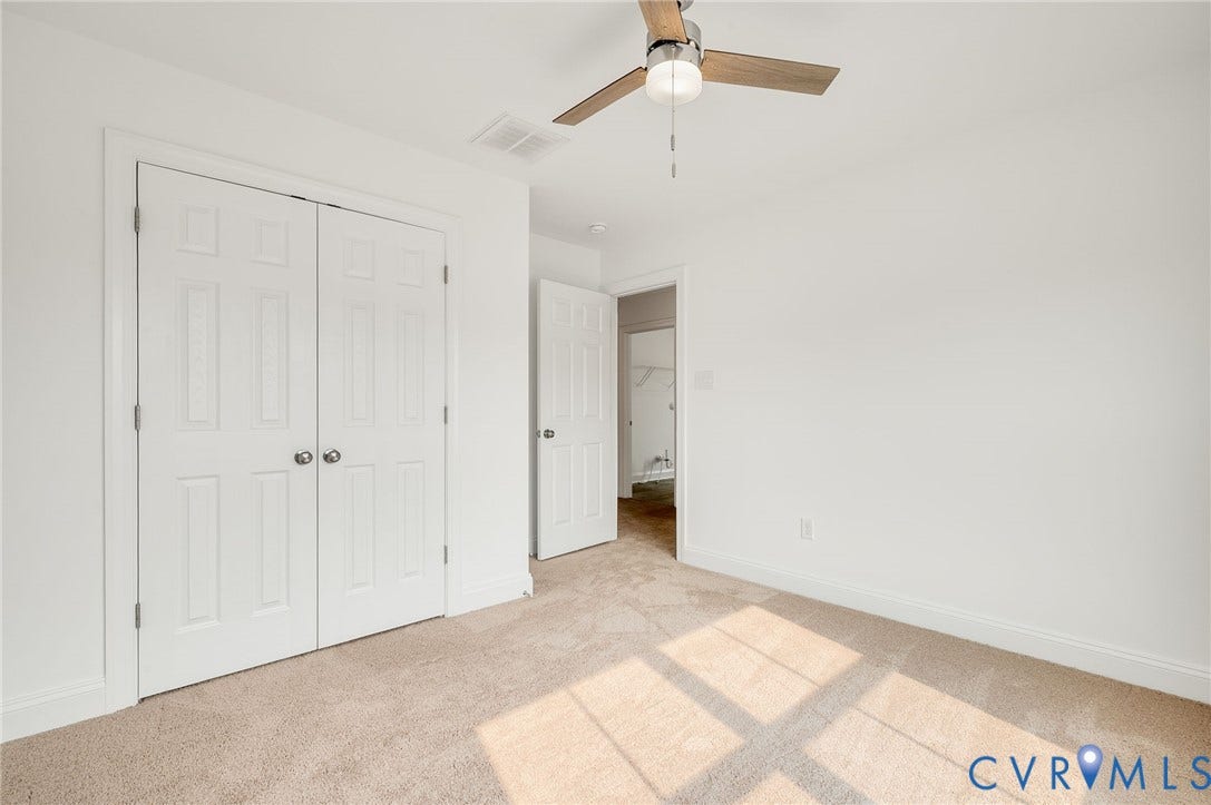 7130 Maple Summit Lane, Moseley, VA 23120 Bedroom featuring neutral carpeting, white trim, and a ceiling fan with wood-finish blades