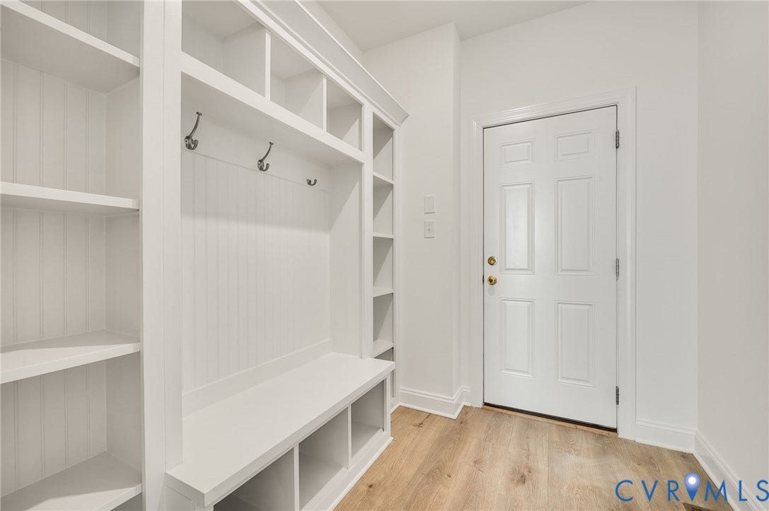 7130 Maple Summit Lane, Moseley, VA 23120 Built-in mudroom storage featuring multiple open shelves, cubbies, and coat hooks