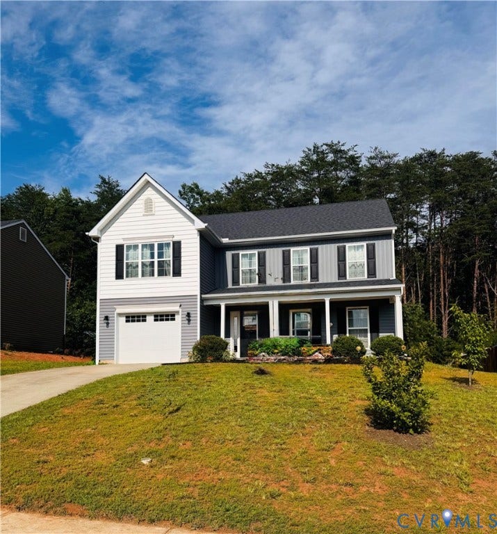 Two-story residence featuring a covered front porch with white columns, a single-car garage, and a sloped front yard