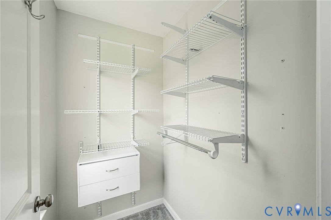 1324 Stone Ridge Park Loop, Henrico, VA 23228 Built-in closet system featuring wire shelving, a hanging rod, and two integrated drawers with chrome hardware