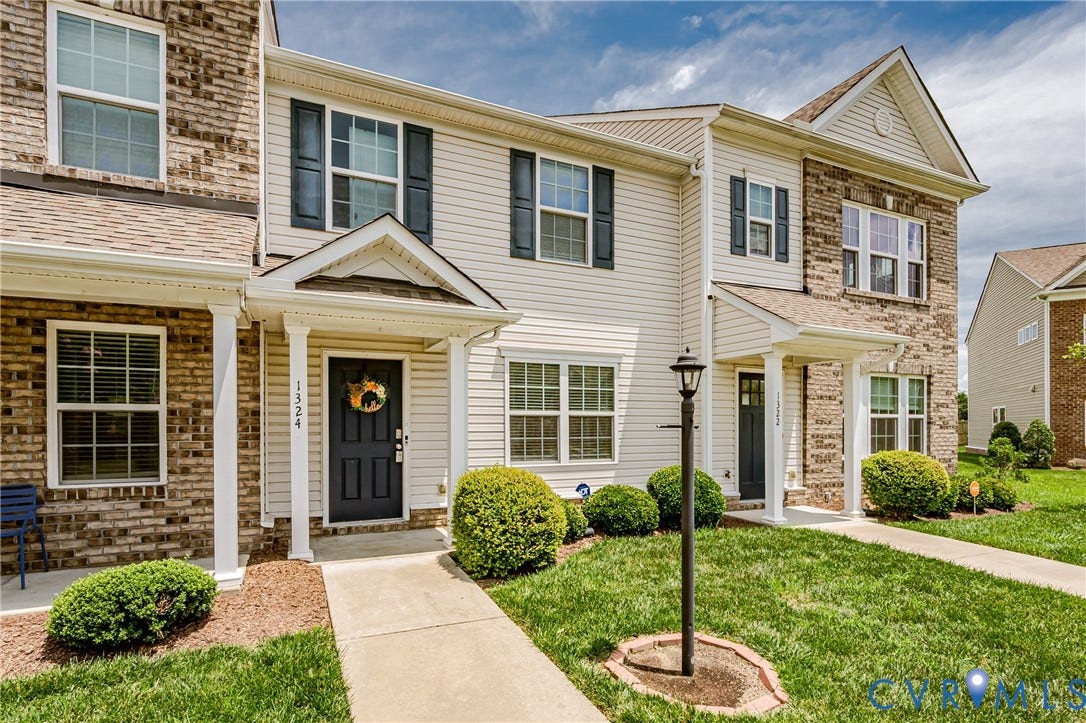 1324 Stone Ridge Park Loop, Henrico, VA 23228 Exterior featuring brick and siding facade, covered front porch, and black paneled door