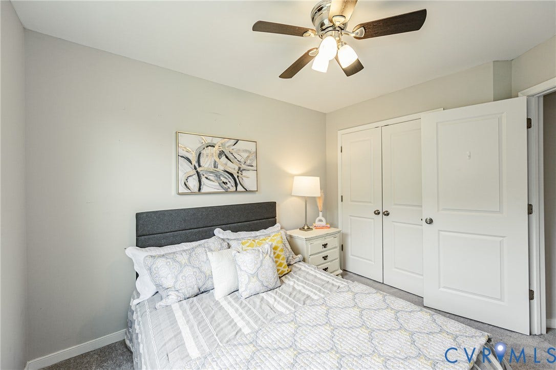 1324 Stone Ridge Park Loop, Henrico, VA 23228 Bedroom featuring carpet flooring, light gray wall paint, a ceiling fan with light fixture, and white bi-fold closet doors
