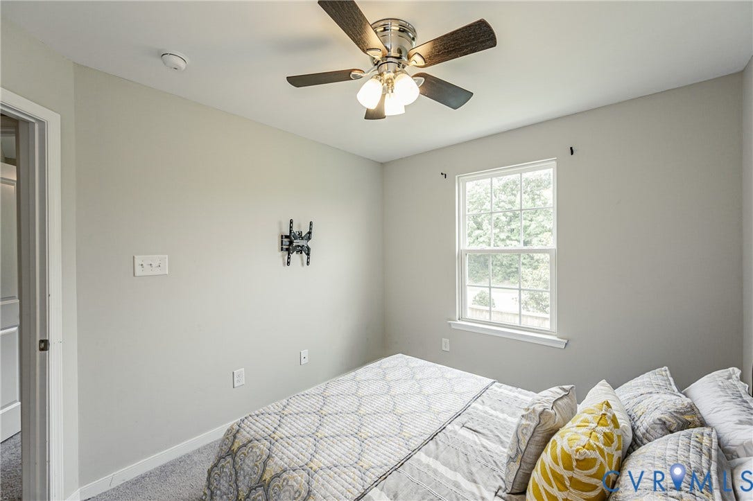 1324 Stone Ridge Park Loop, Henrico, VA 23228 Interior room featuring light gray walls, a ceiling fan with integrated lighting, a double-hung window, and gray carpet flooring