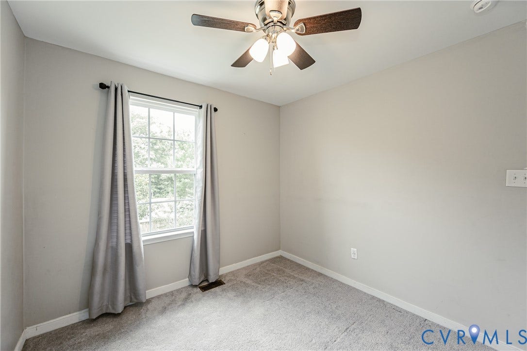 1324 Stone Ridge Park Loop, Henrico, VA 23228 Neutral tone walls, ceiling fan with light fixture, double-hung window, and gray carpeting