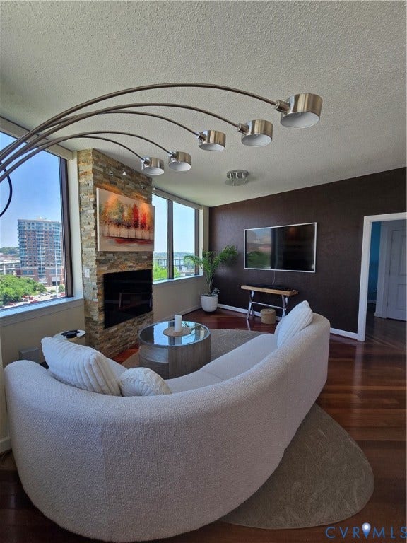 1101 Haxall Point, #815, Richmond, VA 23219 Living area featuring wood-finish flooring and expansive windows