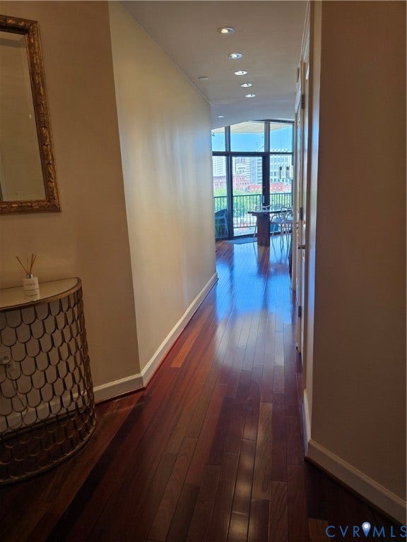 1101 Haxall Point, #815, Richmond, VA 23219 Hallway with rich wood-finish flooring, recessed lighting, and a neutral wall palette