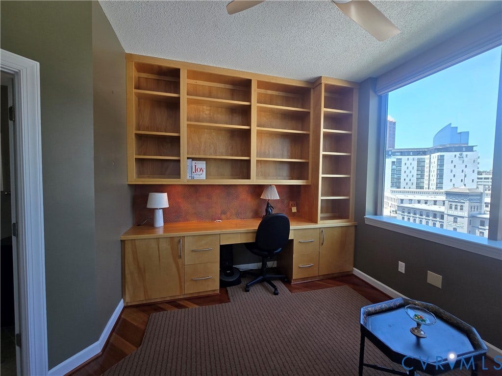 1101 Haxall Point, #815, Richmond, VA 23219 Integrated light wood-finish built-in desk with shelving and cabinetry