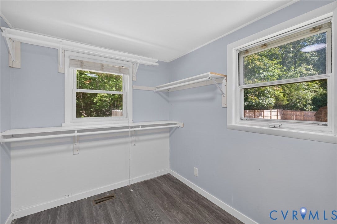 13070 Auburn Mill Road, Glen Allen, VA 23059 Room featuring two windows, wood-finish flooring, and built-in shelving with hanging rods