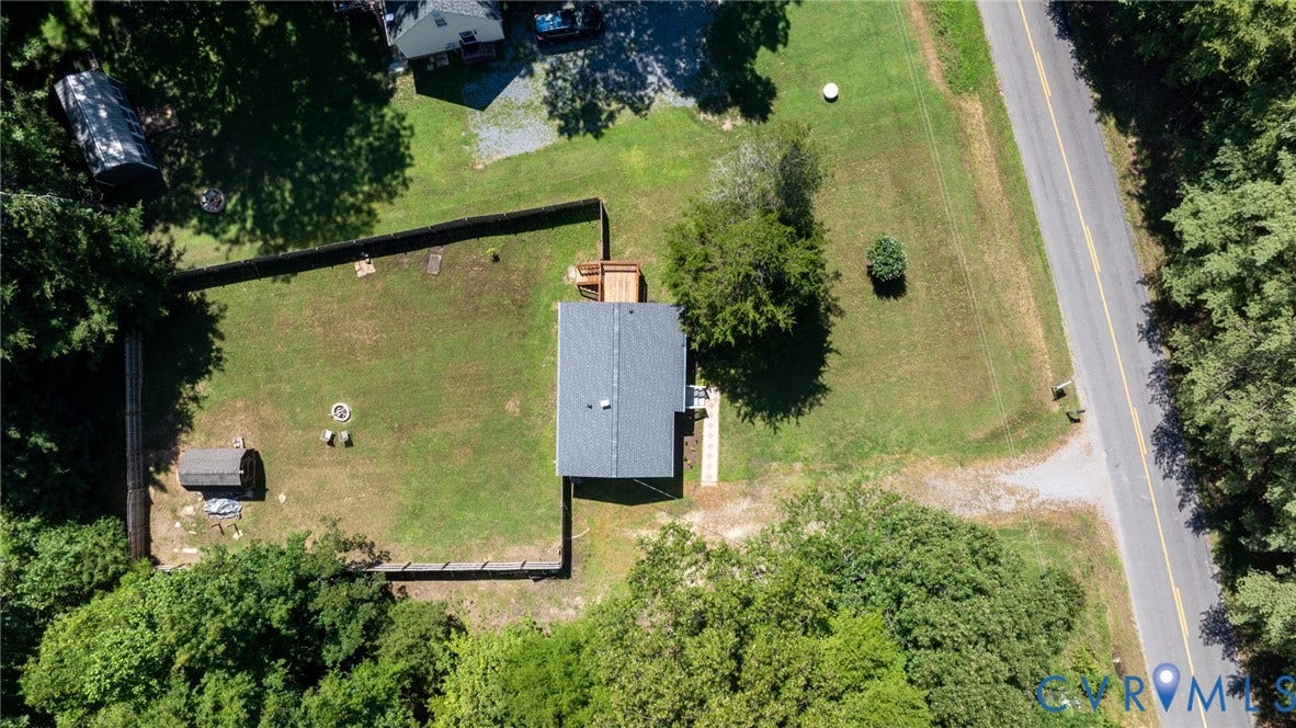 13070 Auburn Mill Road, Glen Allen, VA 23059 Expansive property featuring a single-story dwelling with a dark grey roof, a large fenced yard, an outbuilding, and mature trees
