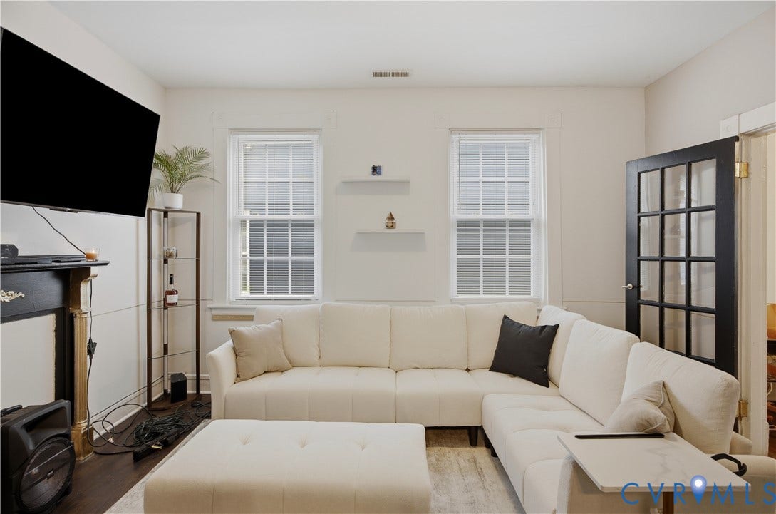 1615 N 19th Street, Richmond, VA 23223 Living area with dark wood-finish flooring and light-toned walls