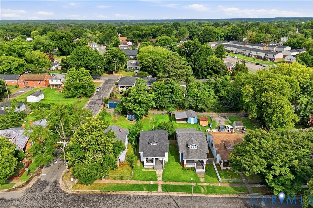1615 N 19th Street, Richmond, VA 23223 Aerial perspective showcasing a residential neighborhood with a mix of single-family homes and townhouses