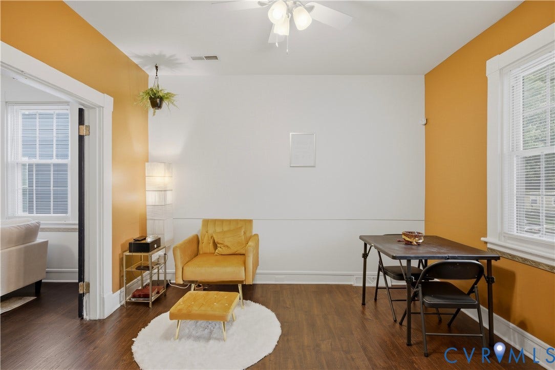 1615 N 19th Street, Richmond, VA 23223 Interior space featuring wood-finish flooring, a ceiling fan with integrated lighting, and a window with blinds