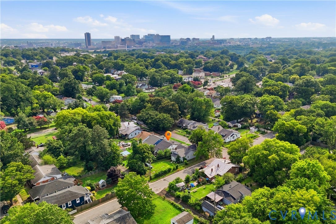 1615 N 19th Street, Richmond, VA 23223 Expansive aerial perspective showcasing a residential neighborhood with a distant cityscape