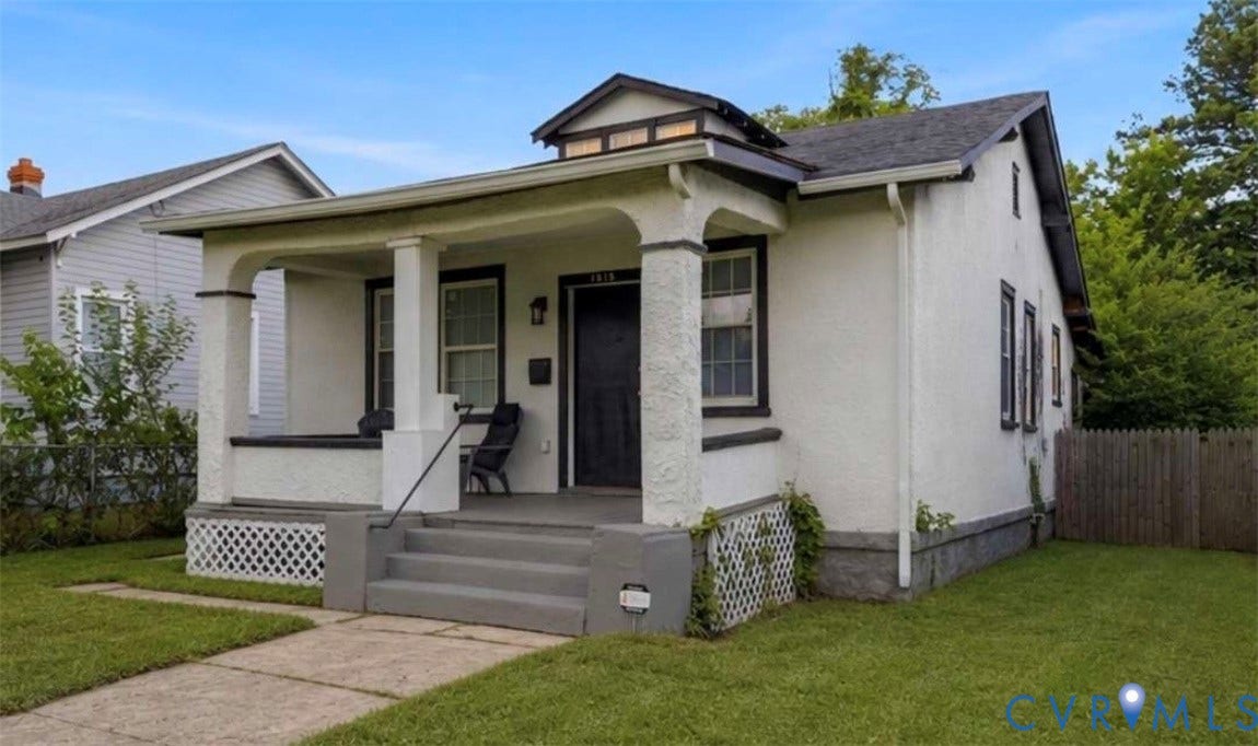 1615 N 19th Street, Richmond, VA 23223 Stucco exterior with a covered front porch featuring square columns and a black metal handrail