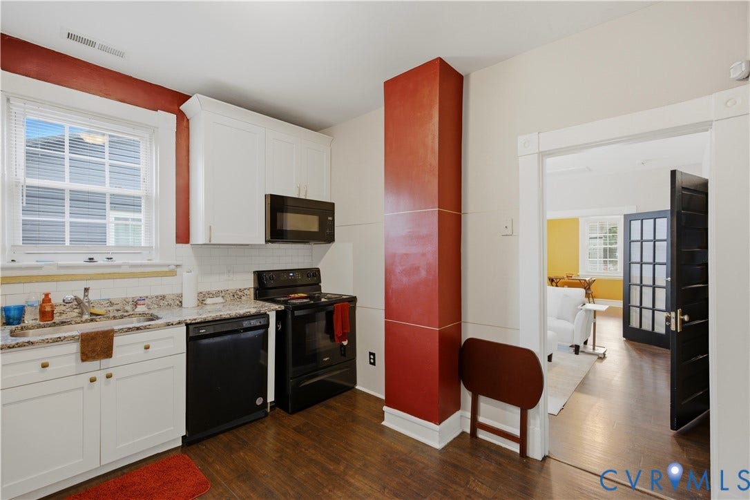 1615 N 19th Street, Richmond, VA 23223 Compact kitchen featuring wood-finish flooring, white cabinetry, and granite-style countertops