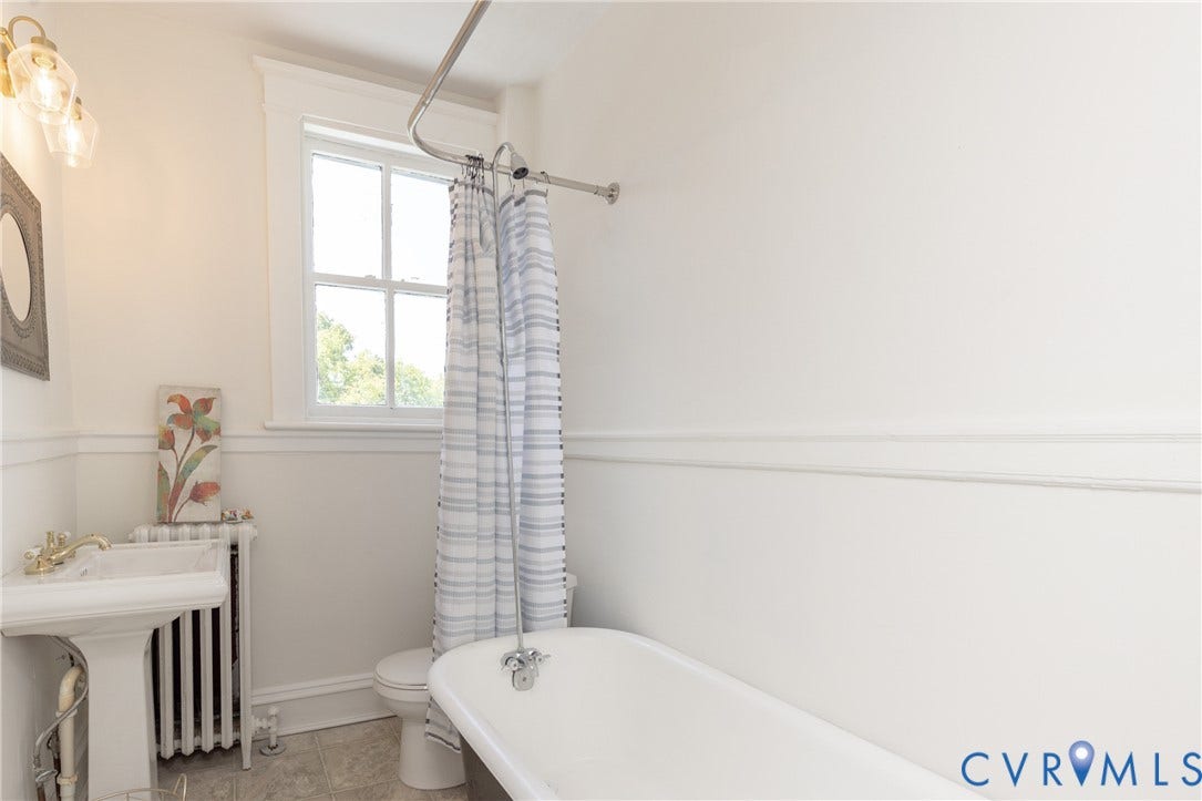 3135 Floyd Avenue, Museum District, Richmond, VA 23221 White ceramic pedestal sink with brass-finish faucet