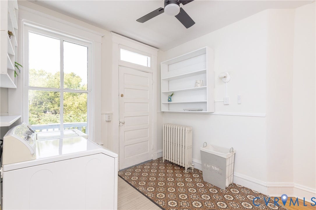 3135 Floyd Avenue, Museum District, Richmond, VA 23221 Laundry area featuring a large window, patterned floor tile, built-in shelving, a ceiling fan, and a radiator