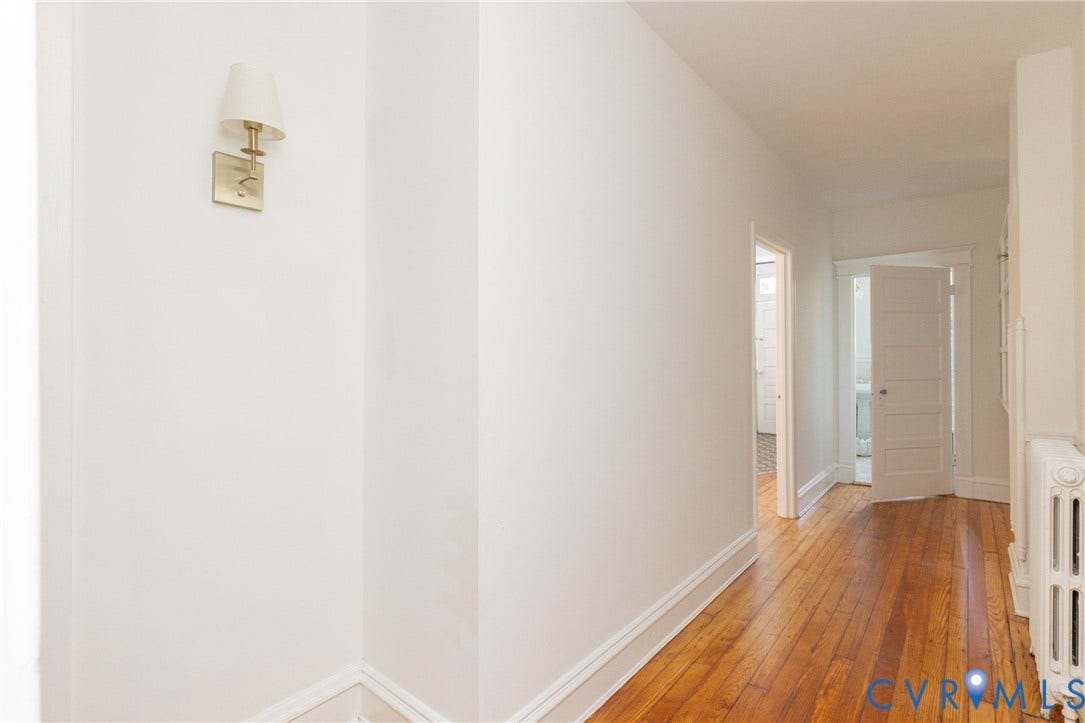 3135 Floyd Avenue, Museum District, Richmond, VA 23221 Hardwood flooring throughout a bright hallway with white walls