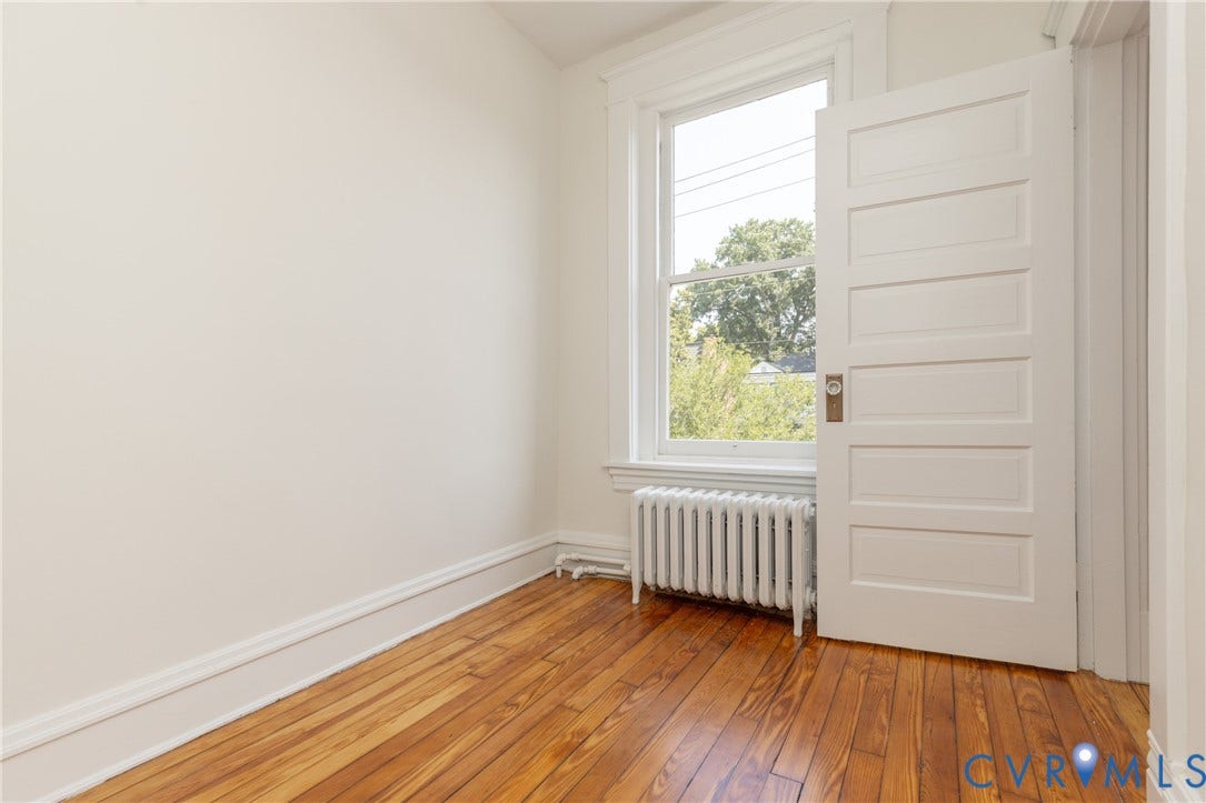 3135 Floyd Avenue, Museum District, Richmond, VA 23221 Hardwood flooring featured in a bright room with white walls