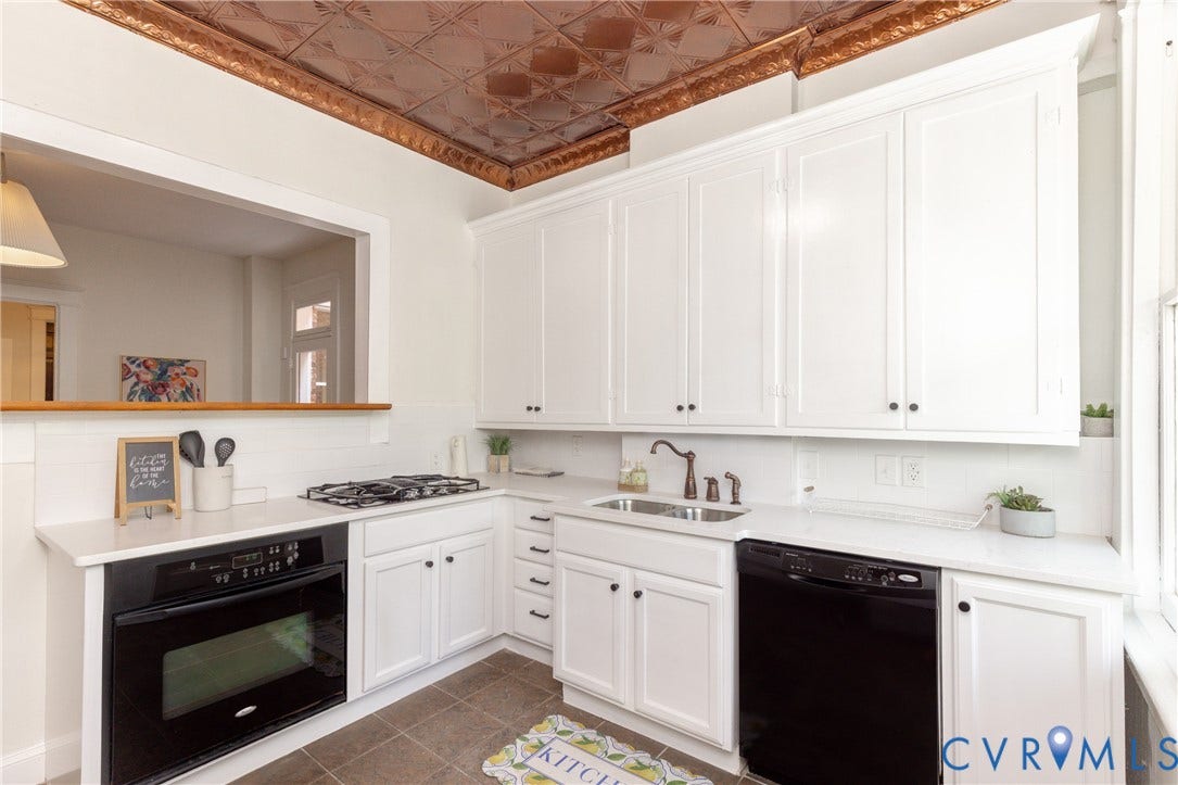 3135 Floyd Avenue, Museum District, Richmond, VA 23221 Kitchen featuring white shaker-style cabinetry, a built-in oven, a gas cooktop, a stainless steel sink with a dark bronze faucet, and a black dishwasher