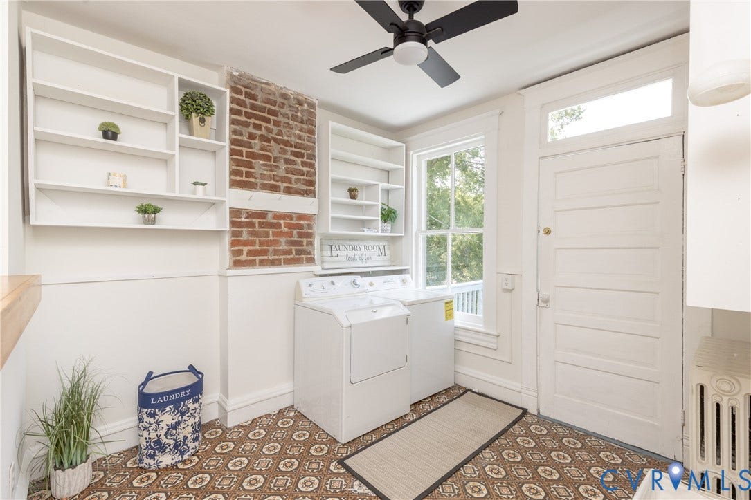 3135 Floyd Avenue, Museum District, Richmond, VA 23221 Laundry area featuring white built-in shelving, exposed brick detailing, a patterned floor, and a ceiling fan