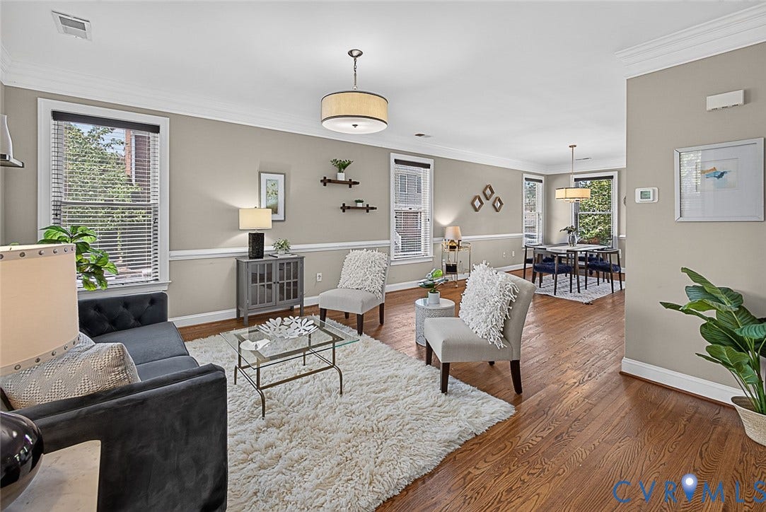 710 S Laurel Street, Oregon Hill, Richmond, VA 23220 Open-concept living area featuring rich wood-finish flooring, neutral wall tones, and extensive crown molding