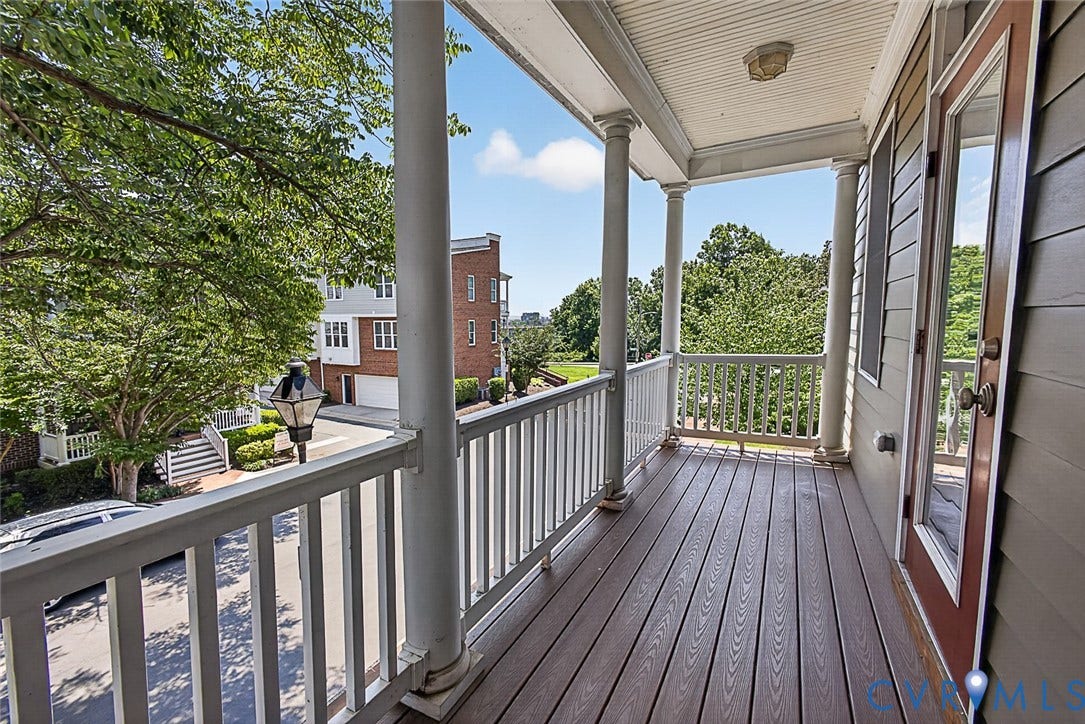 710 S Laurel Street, Oregon Hill, Richmond, VA 23220 Expansive balcony featuring composite decking, white balusters, and substantial support columns