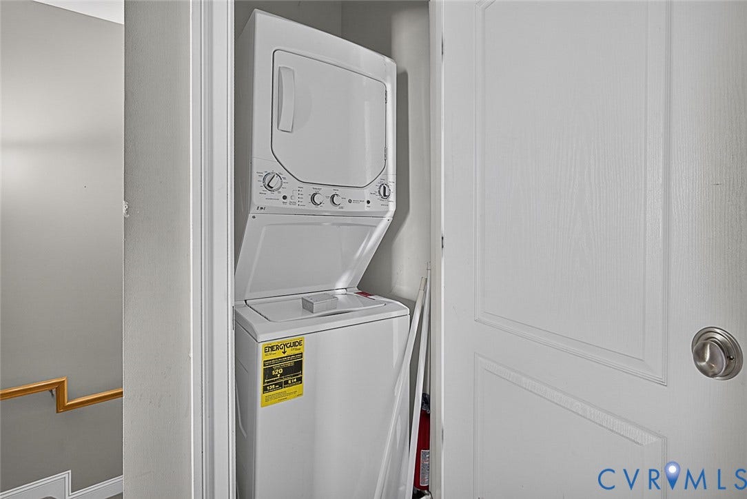 710 S Laurel Street, Oregon Hill, Richmond, VA 23220 Dedicated laundry closet featuring a stacked white washer and dryer unit